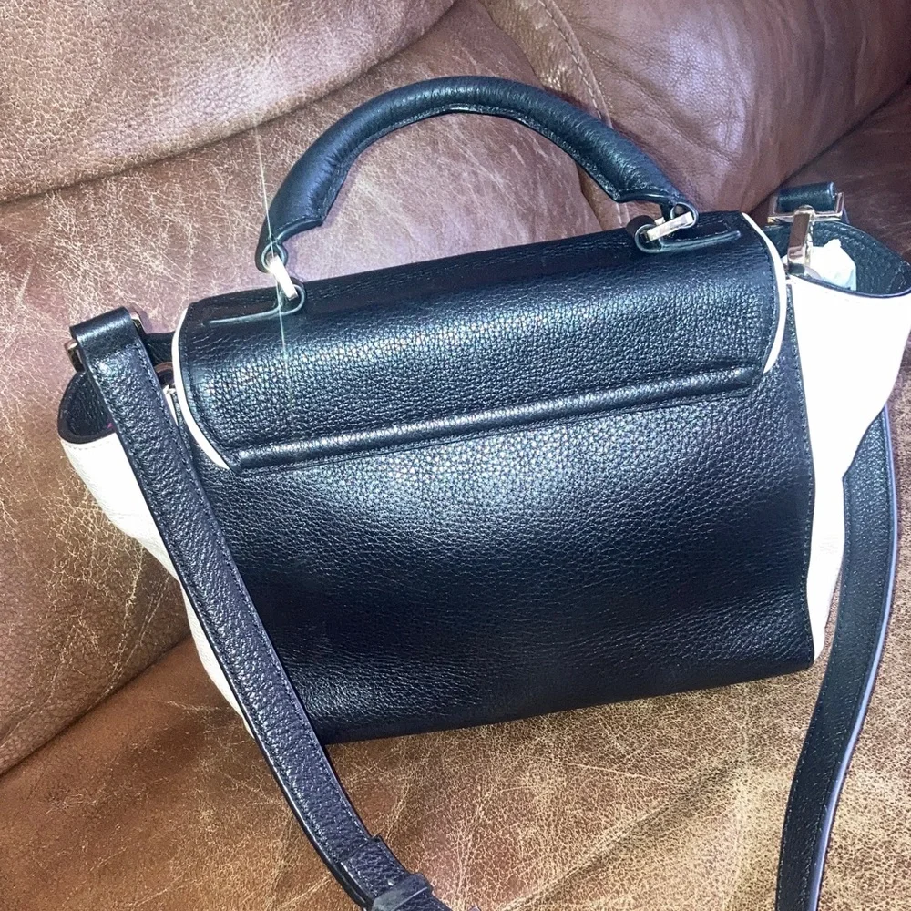 Kate Spade Elegant Black and White pebbled leather Handbag with crossbody strap
